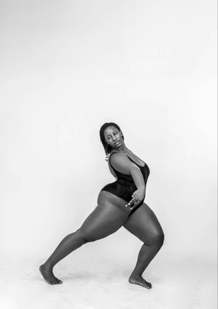 Woman in Leotard Stretching