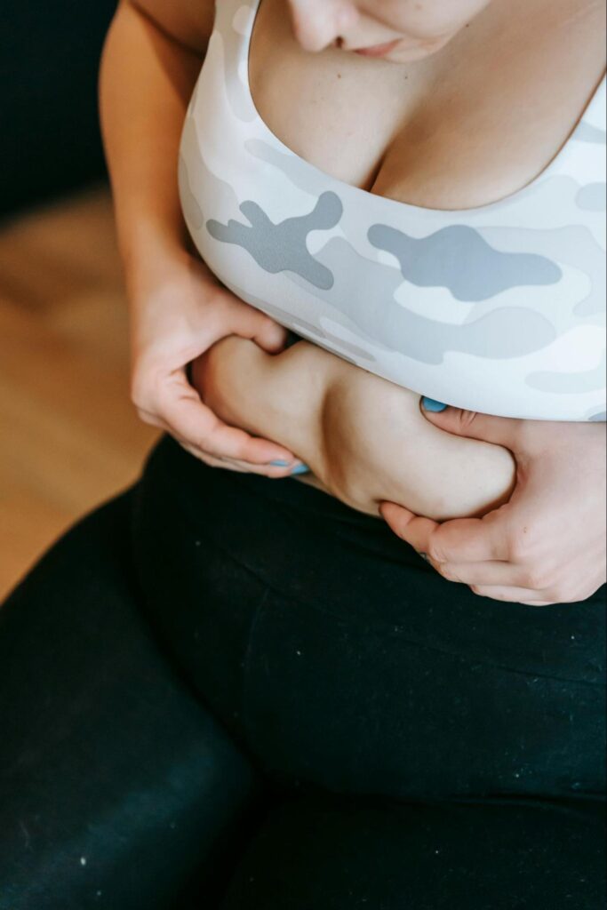 Woman Grabbing Stomach